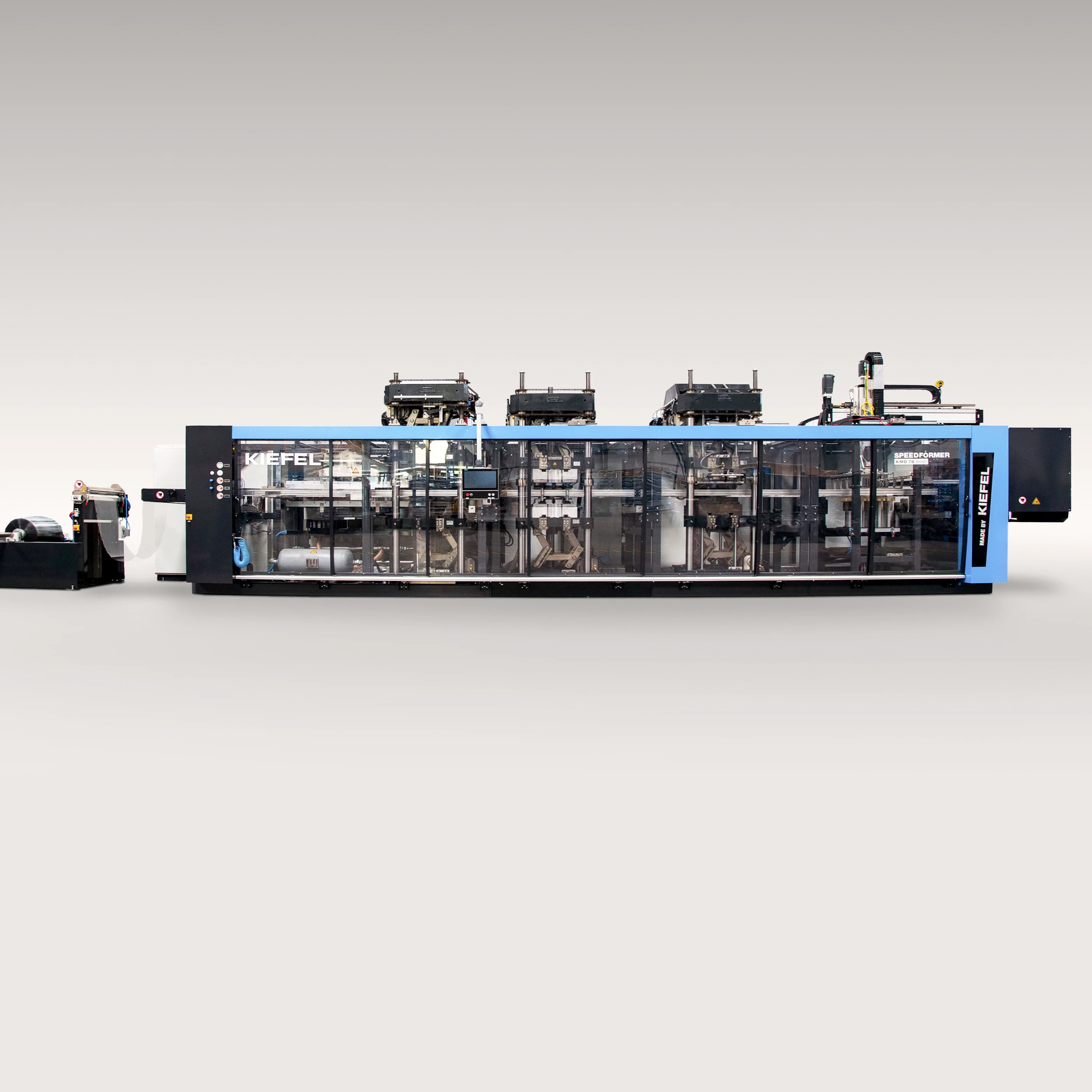 Máquina industrial de procesamiento de plásticos con enclavamientos de seguridad transparentes y componentes integrados de manejo de rollos. - Kiefel GmbH | Cpsemarketplace

