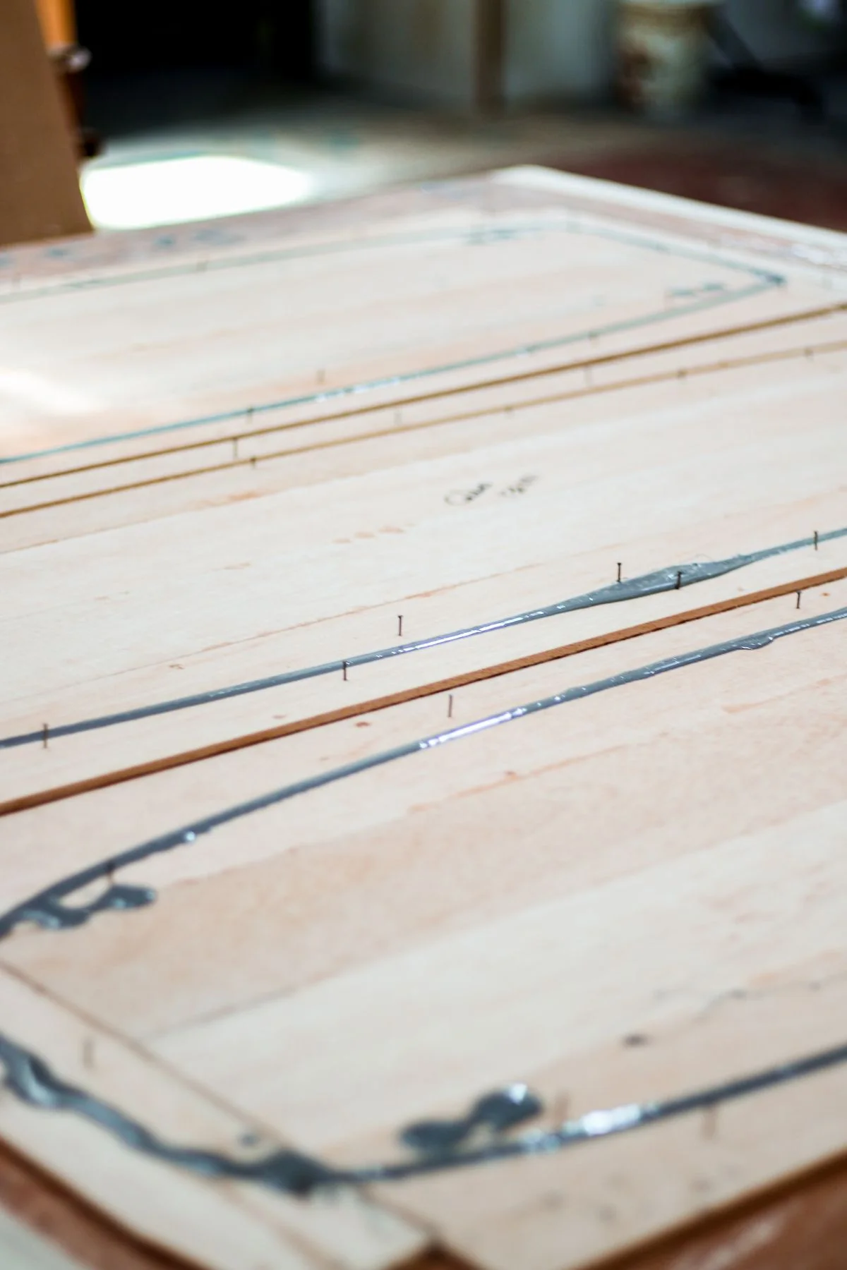 Layered wooden boards bonded with evenly applied lines of phenolic resin adhesive. - Pexels

