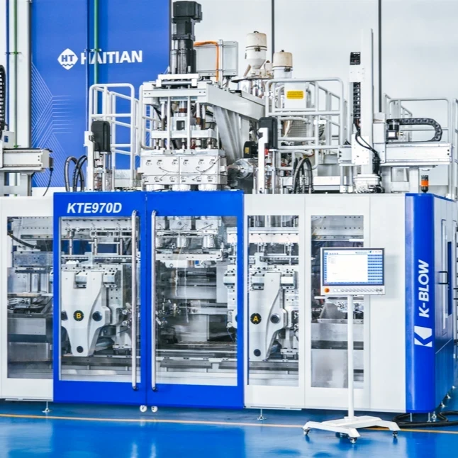 Máquina de moldeo por soplado con carcasas azules y blancas, paneles de control y componentes mecánicos. - Ke Taike Machinery(Guangdong)Co.,Ltd. | Cpsemarketplace

