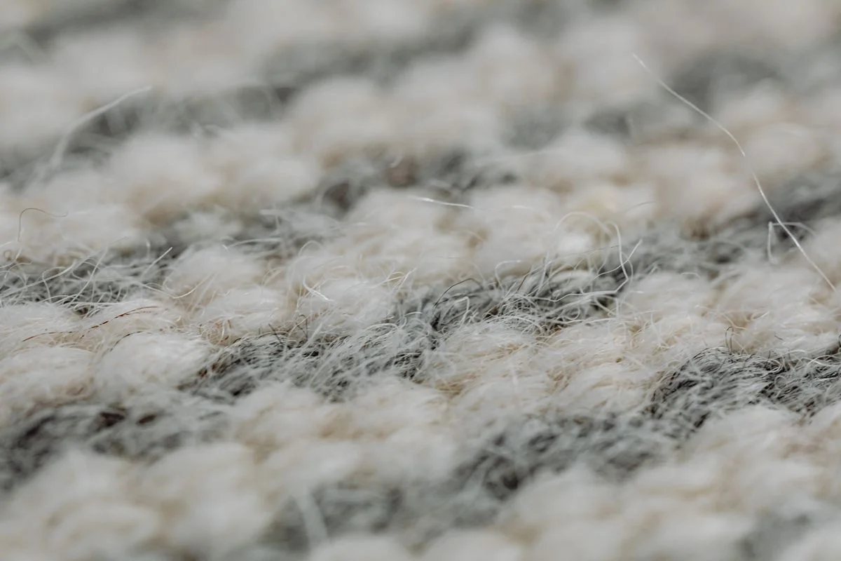 Light-colored synthetic carpet made from fine melt-spun polymer fibers. - Pexels

