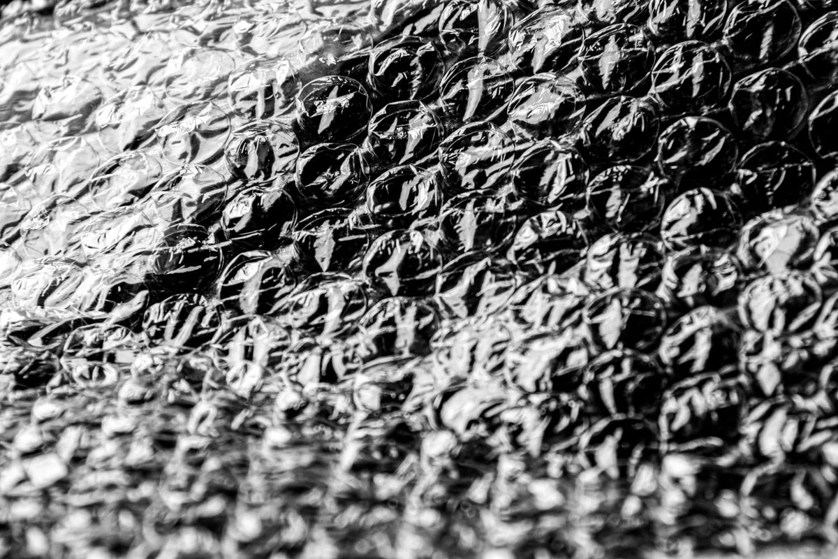 Bubble wrap film with circular embossed patterns from rotary rollers in flexible packaging production. - Pexels

