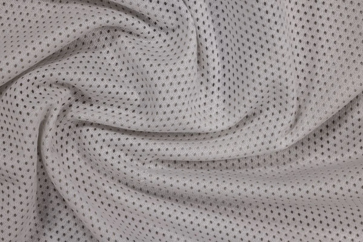 Grey plastic mesh sheet with uniform fine perforations for filtration applications. - Pexels

