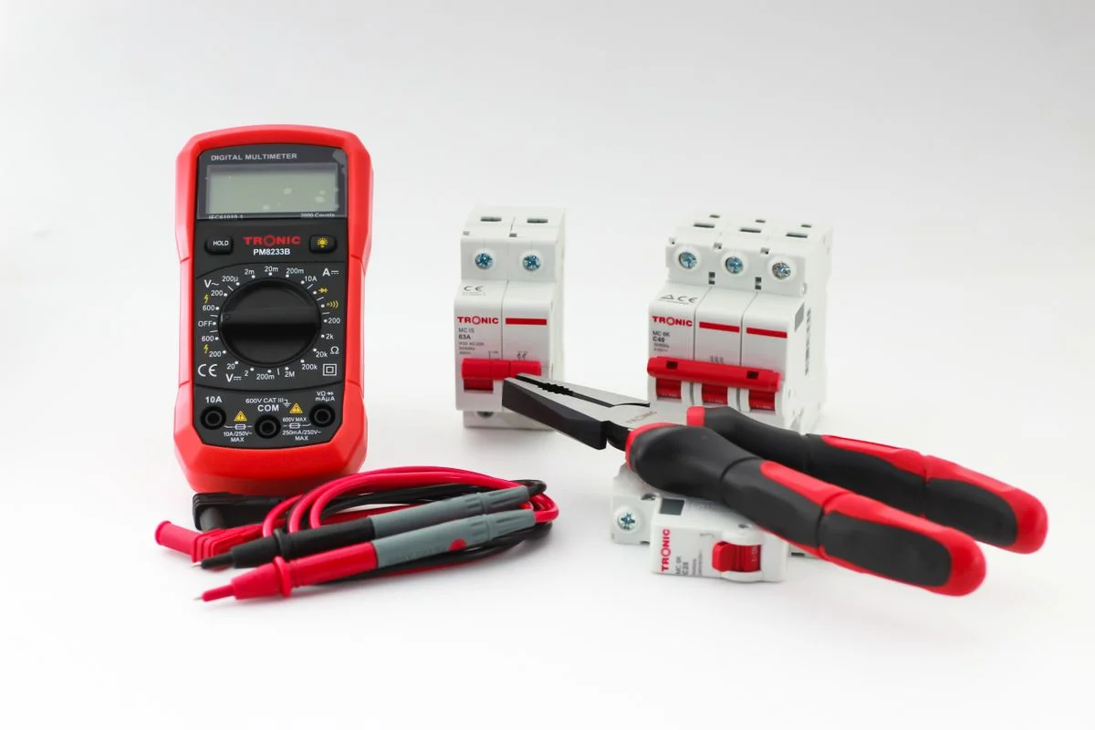 Precision multimeter with insulated leads for maintenance of plastics and rubber processing equipment - Pexels