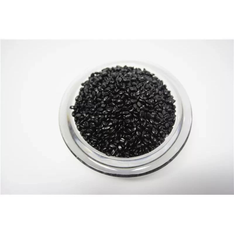 Gránulos de masterbatch de plástico negro brillante llenando un plato de vidrio transparente. - FUJIAN XUYI PLASTIC COLOR MASTERBATCH CO.,LTD. | Cpsemarketplace

